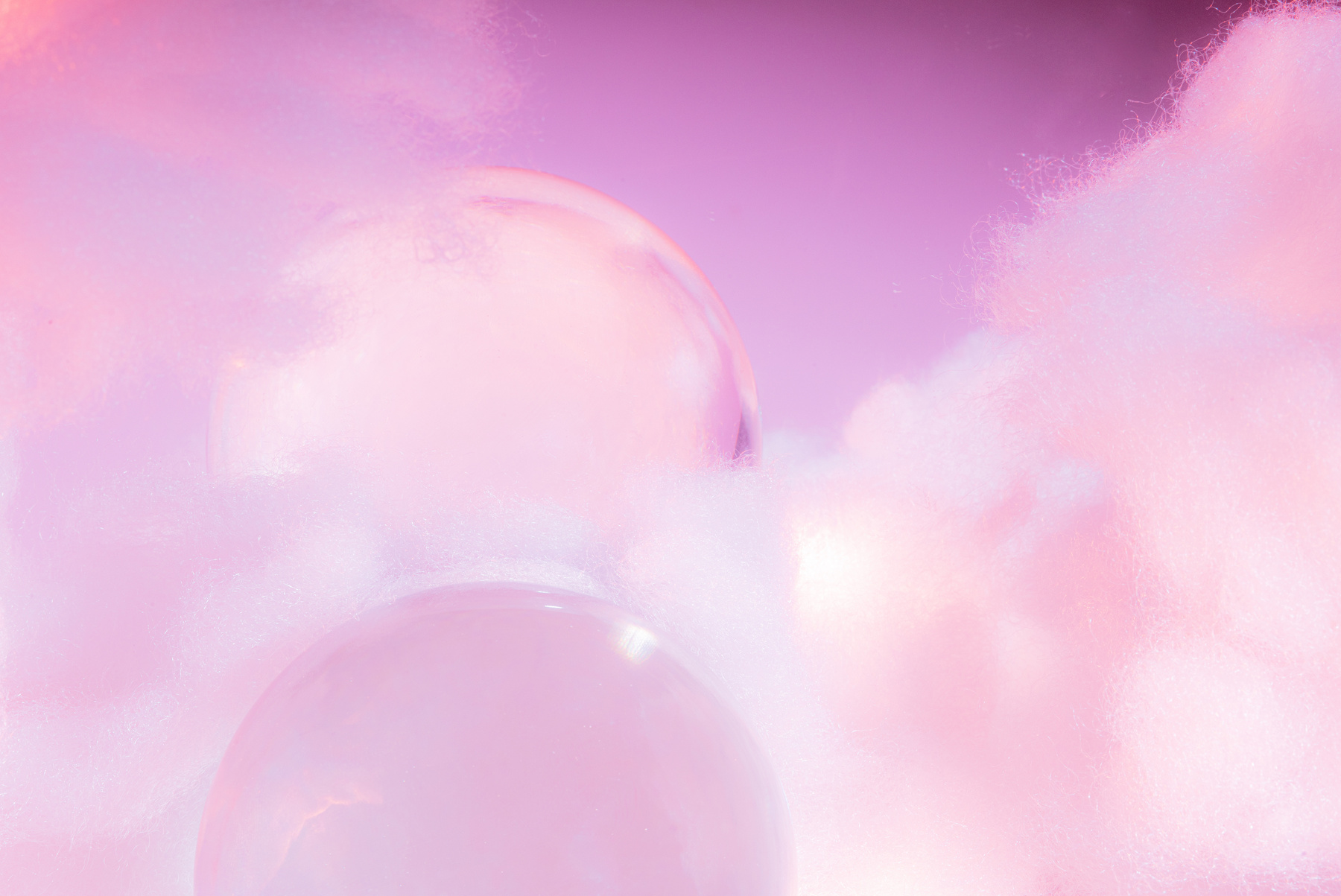 Clear Sphere with Clouds on Pastel Pink Background